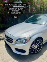 foreign used 2016 Mercedes Benz C300 in sliver on black.