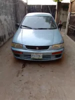 fairly used Mazda 323 for sale at a give away price. neatly used, manual transmission.